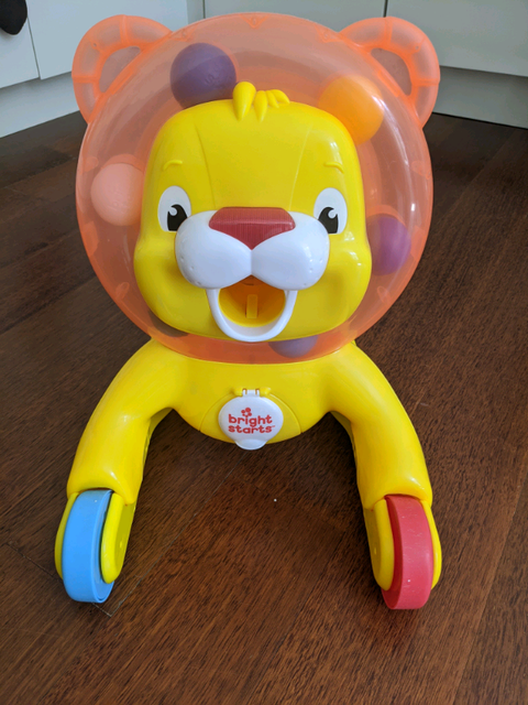 bright starts step n ride lion